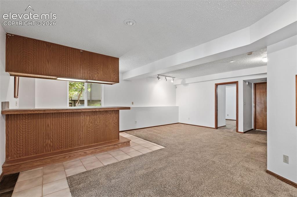 Image 35 of 50: Wet bar! Basement Family Room