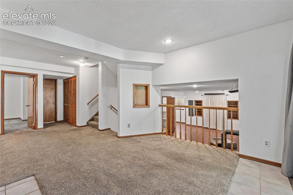 Image 36 of 50: Family room overlooking theater room