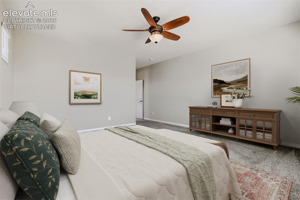 Image 22 of 50: Virtually staged primary bedroom with lux bath and huge closet.