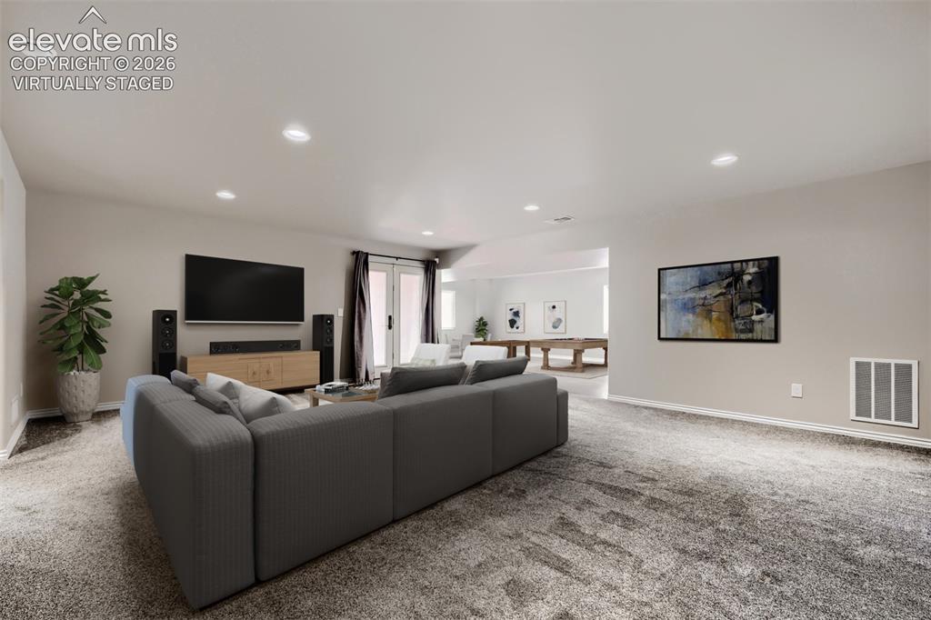 Image 30 of 50: Virtually staged basement family room with walkout, large rec room that can