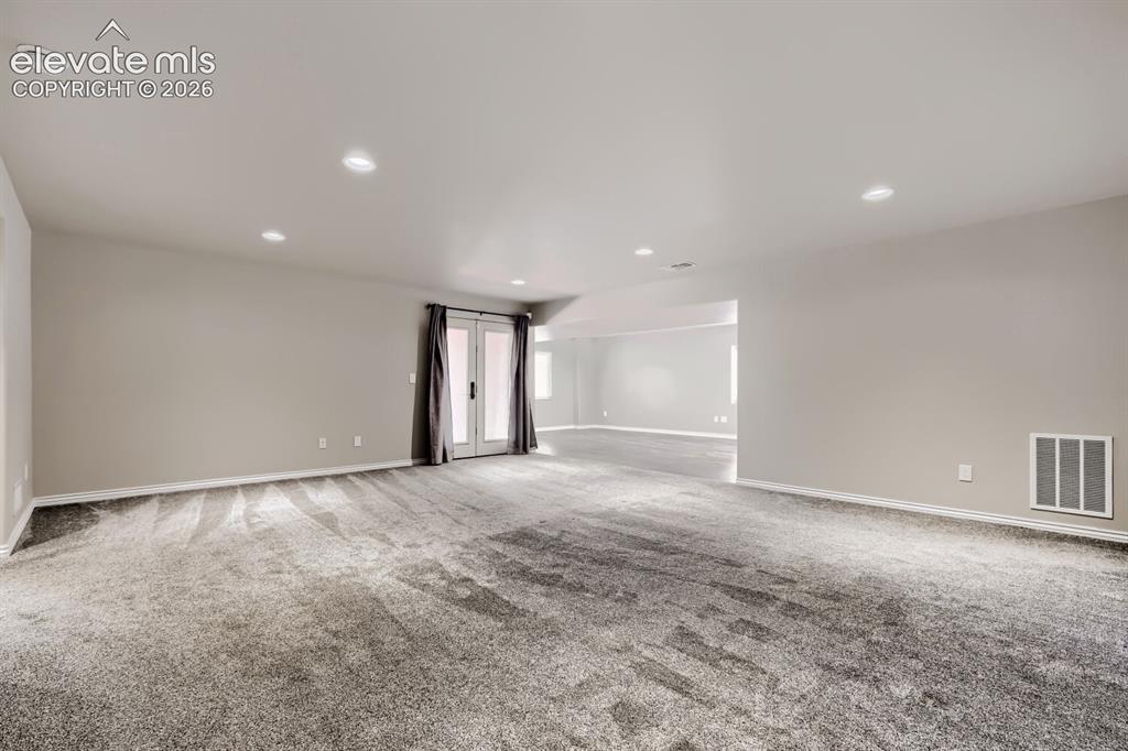 Image 31 of 50: Basement family room with walkout, large rec room that can be game area, ho