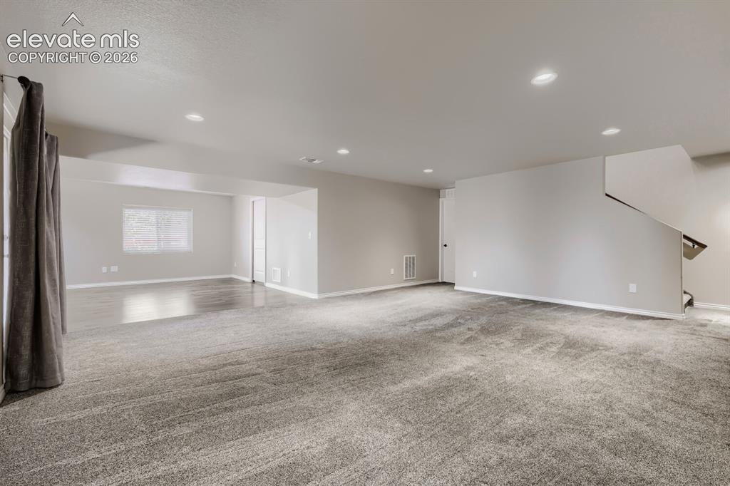 Image 33 of 50: Basement family room with walkout, large rec room that can be game area, ho