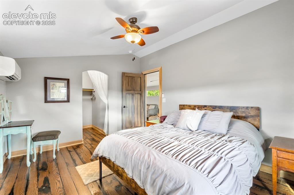 Image 25 of 50: Hardwood flooring, ceiling fan with integrated lighting, mini-split air con