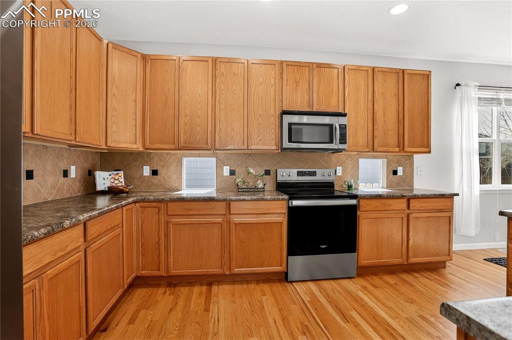 Image 6 of 20: Extra tall cabinets & island