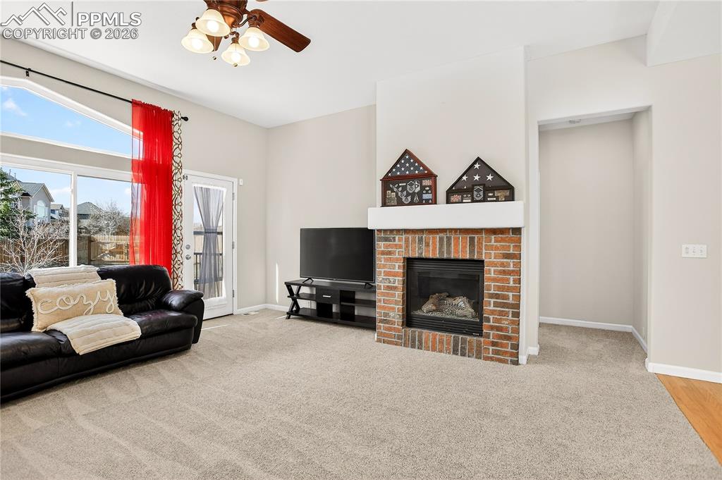 Image 9 of 20: Family room w/ gas fireplace