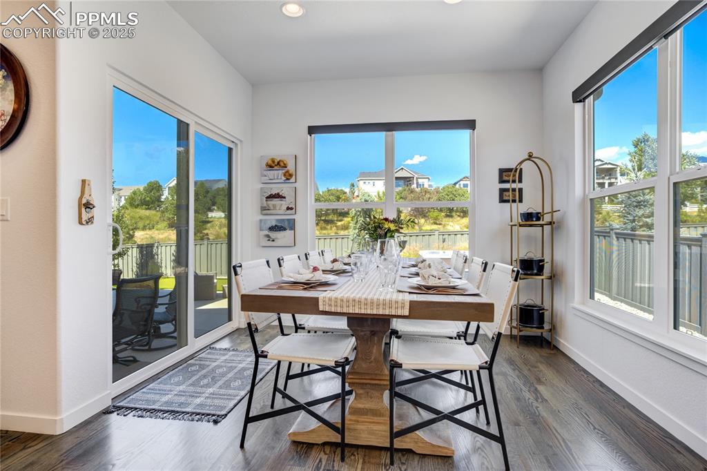 Image 12 of 50: • Sunlit dining — easy service from the kitchen, open to great room, and an