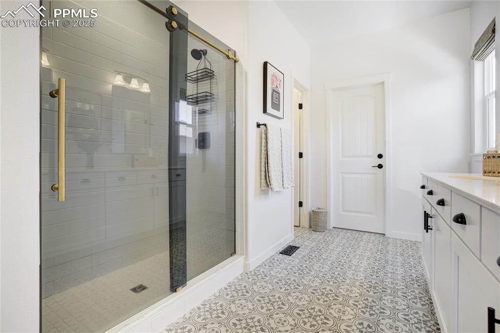 Image 21 of 50: Spacious owner’s suite on the main featuring a private, spa-inspired ensuit