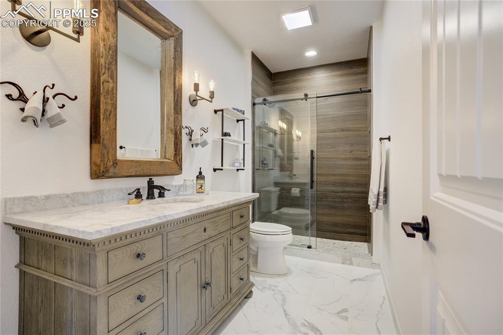 Image 27 of 50: private ensuite (heated floors), organic textural palette