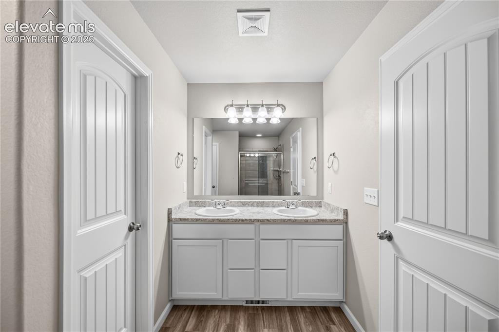 Image 24 of 44: with oversized shower and linen closet