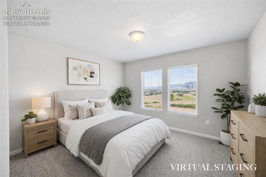 Image 29 of 44: Virtually Staged -Bedroom #3 with incredible mountain views