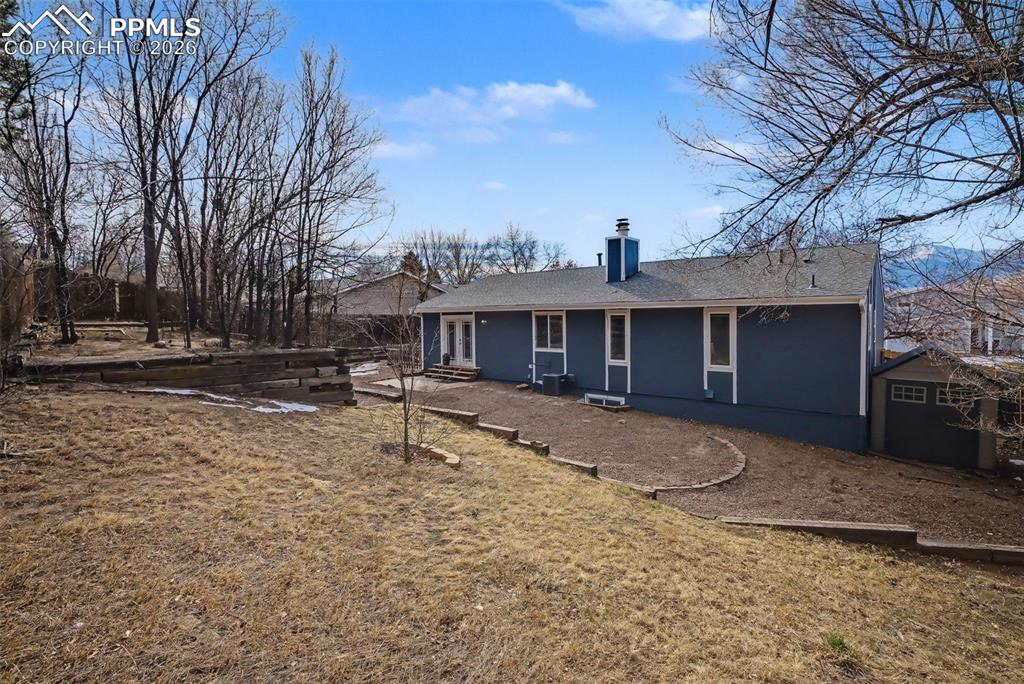 Image 36 of 41: Tiered backyard, storage shed