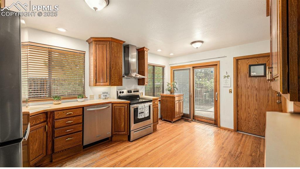 Image 10 of 40: Open and functional kitchen featuringstainless steel appliances, ample coun