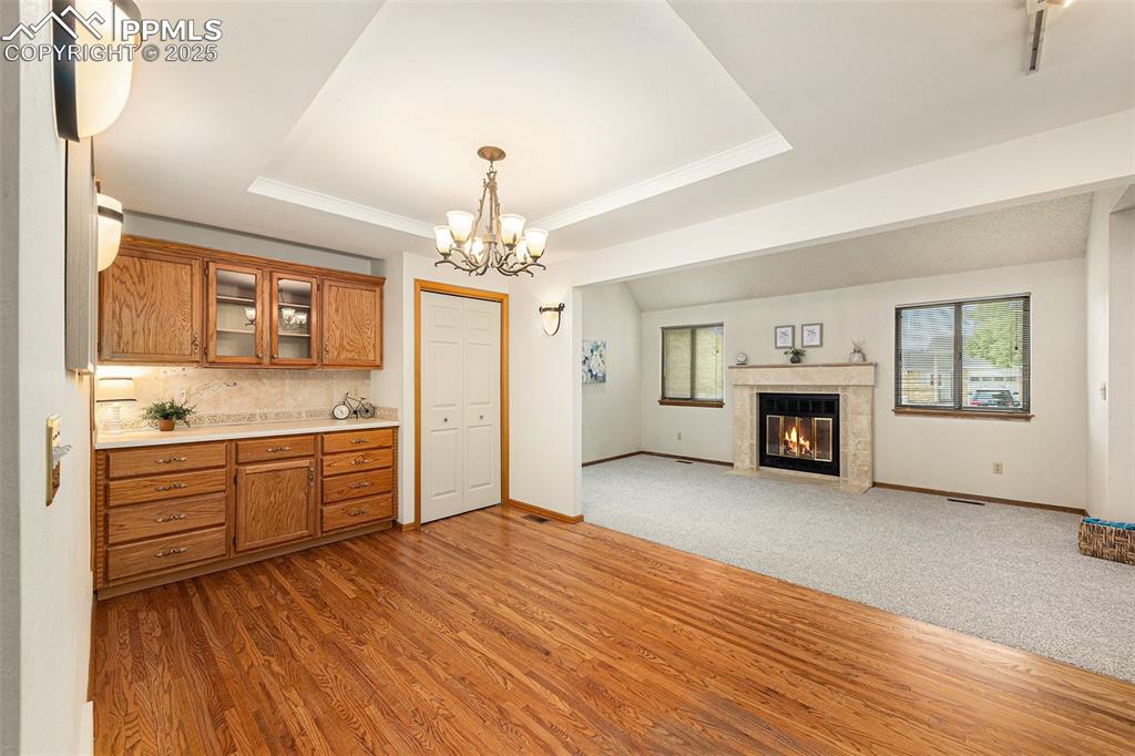 Image 8 of 40: Open-concept living and dining area seamlessley connected for easy entertai