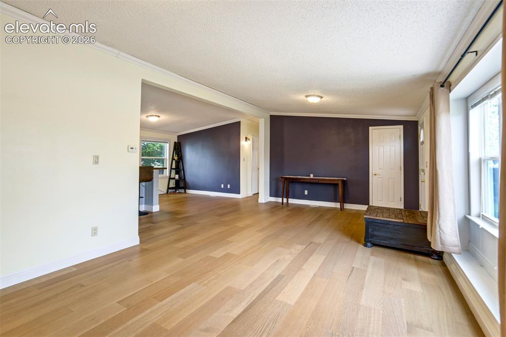 Image 10 of 50: Large front window creates a bright and welcoming atmosphere.