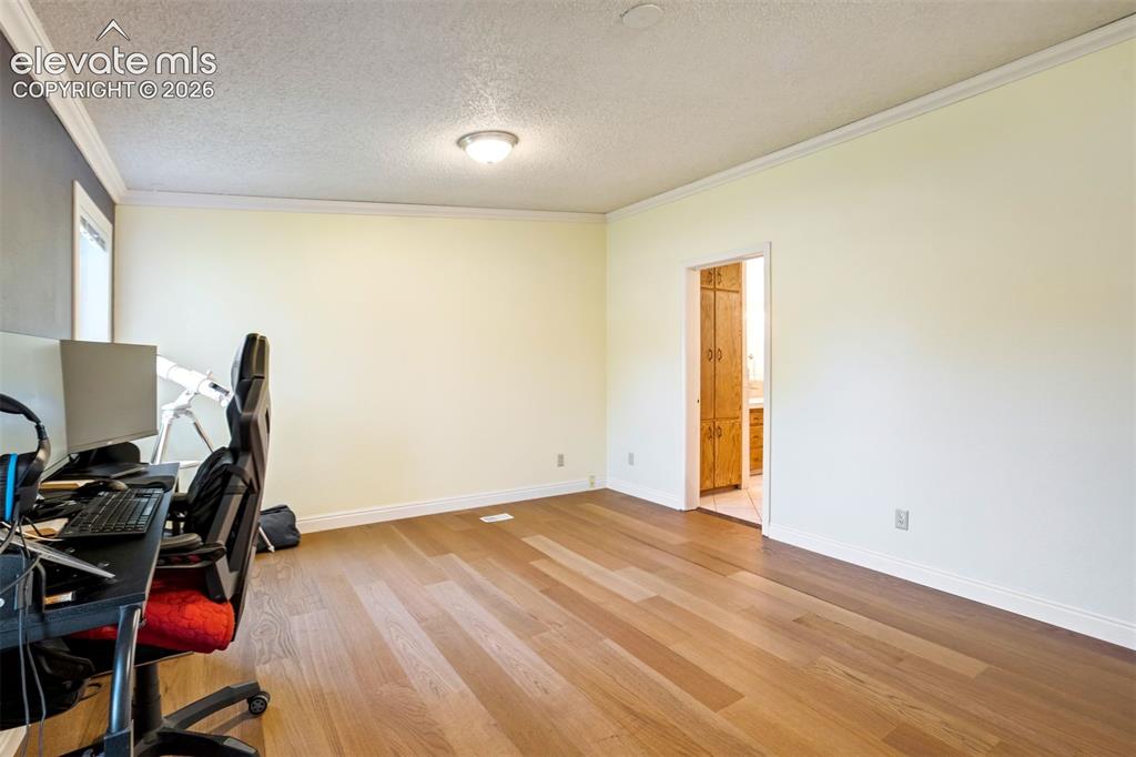 Image 30 of 50: Primary suite offers direct access to the adjoining bathroom.