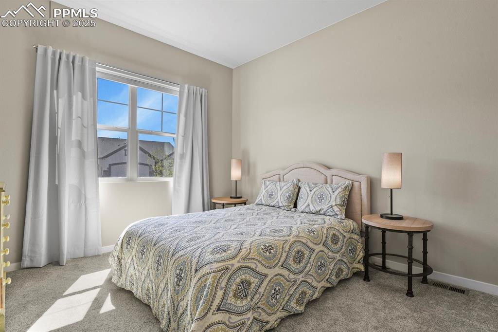 Image 24 of 50: Carpeted bedroom featuring baseboards