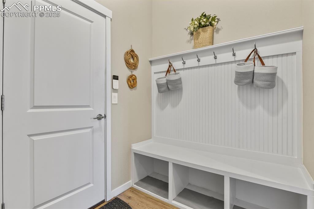 Image 31 of 50: Mudroom featuring light wood-style flooring and baseboards