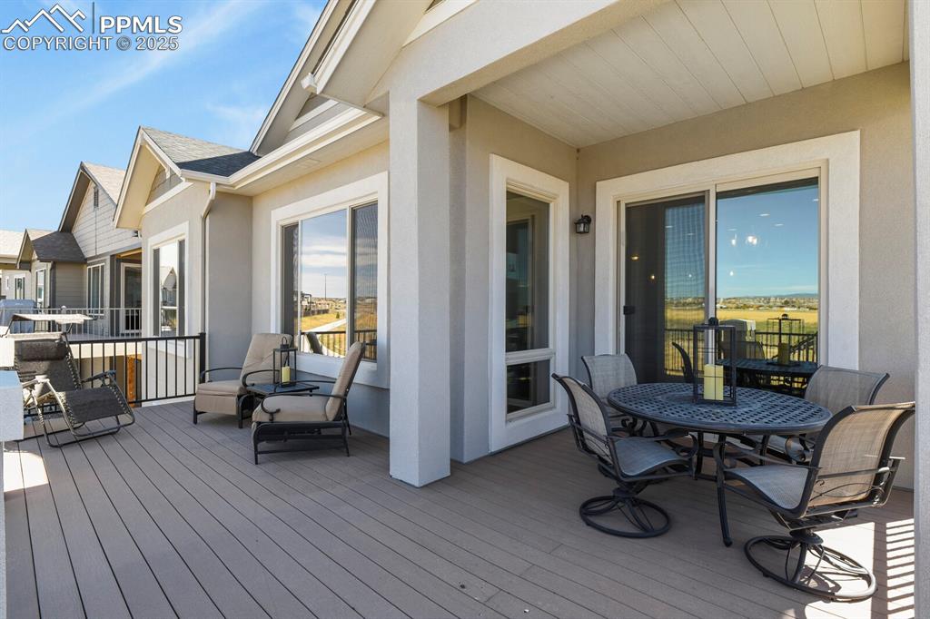 Image 41 of 50: Deck featuring outdoor dining area