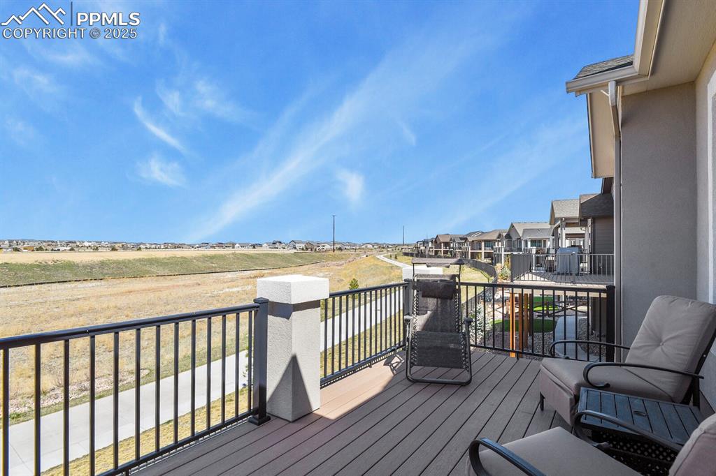 Image 42 of 50: Wooden terrace featuring a residential view