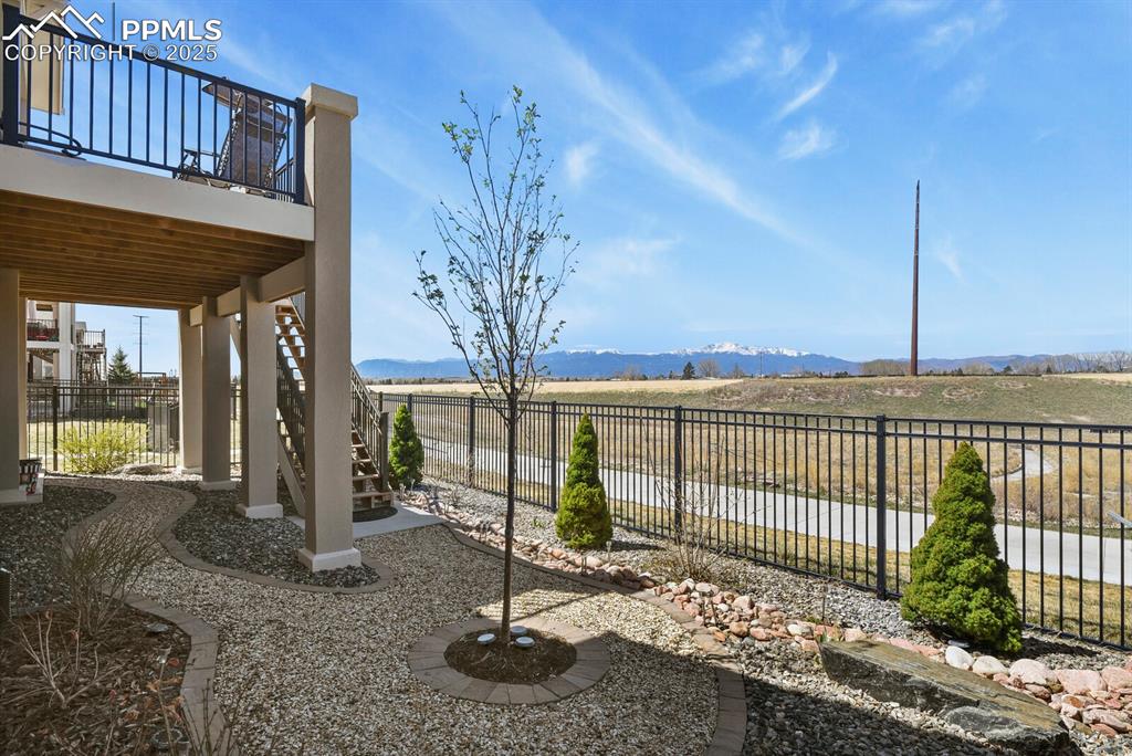 Image 45 of 50: View of yard featuring stairway, a mountain view, a view of rural / pastora