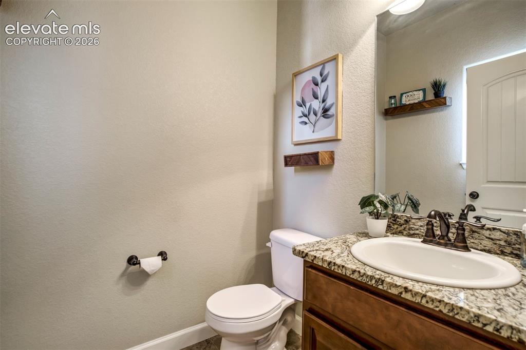 Image 16 of 47: Powder bathroom on the main level. 