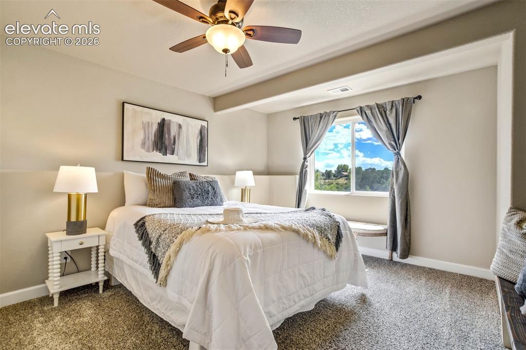 Image 36 of 47: Basement bedroom- perfect for guests, teenagers, in-laws, or anyone who app