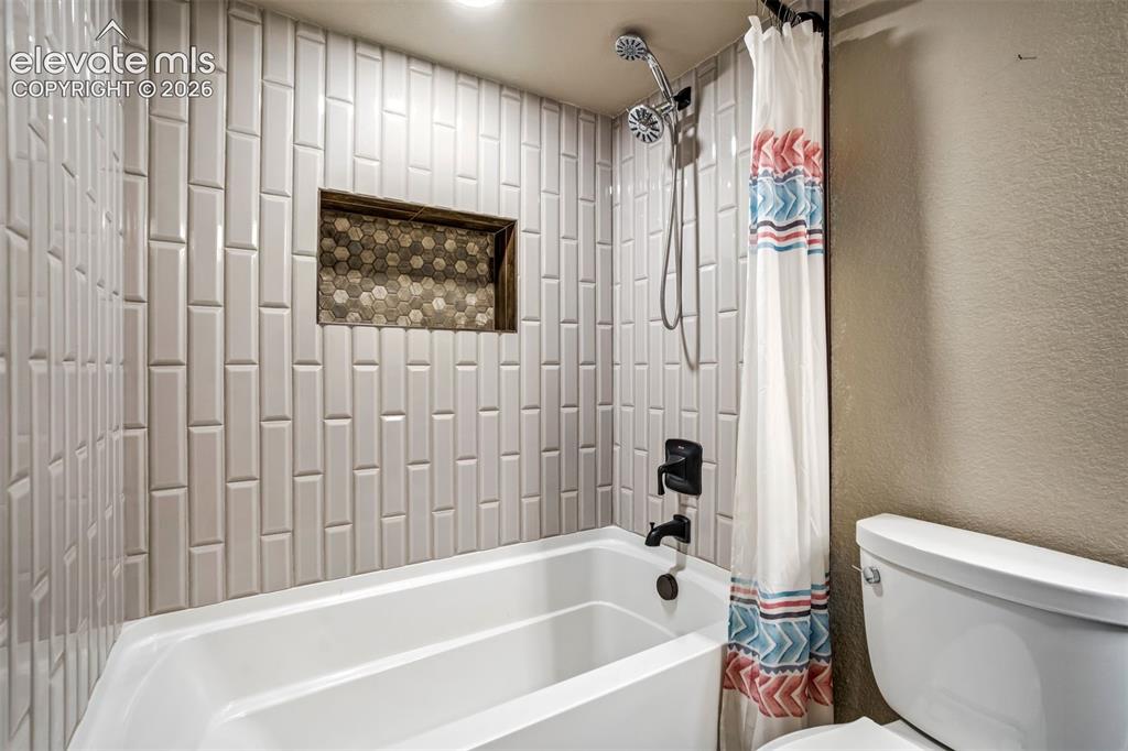Image 39 of 47: Custom tile work in the shower/ tub. 