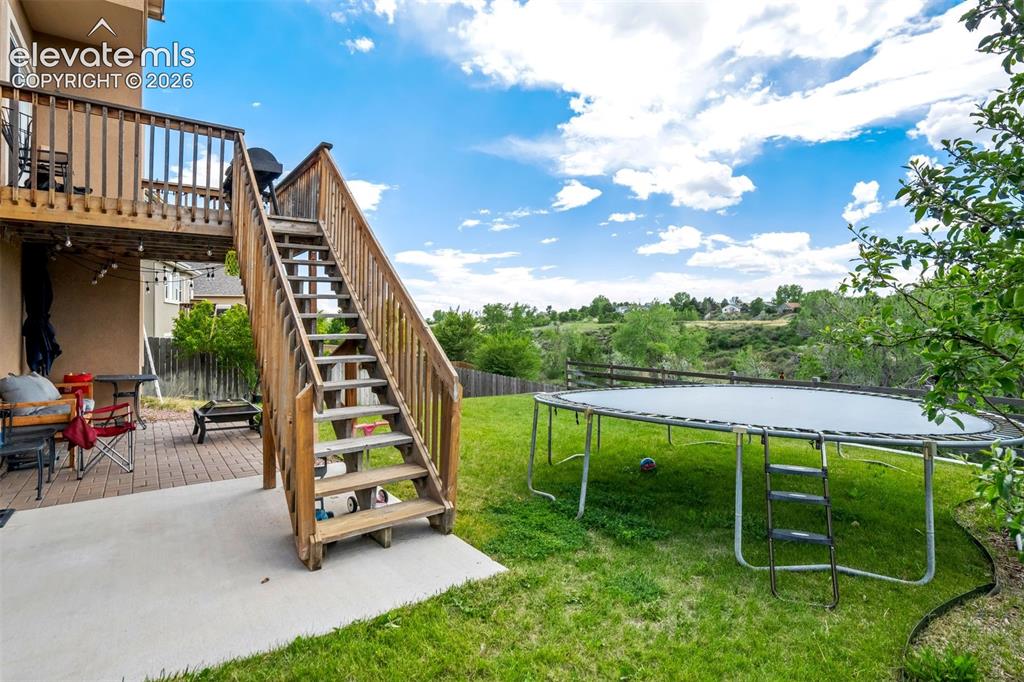 Image 42 of 47: Patio area with plenty of play space. 