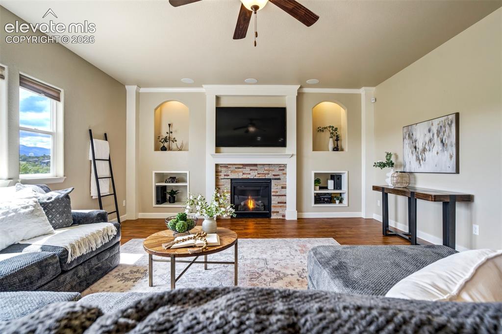 Image 8 of 47: Architectural design features with built-ins & a fireplace. Something every