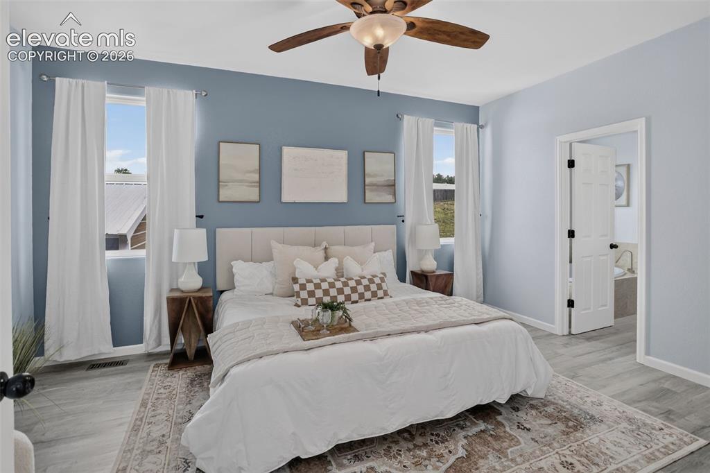 Image 18 of 50: Large primary bedroom with ensuite bathroom.
