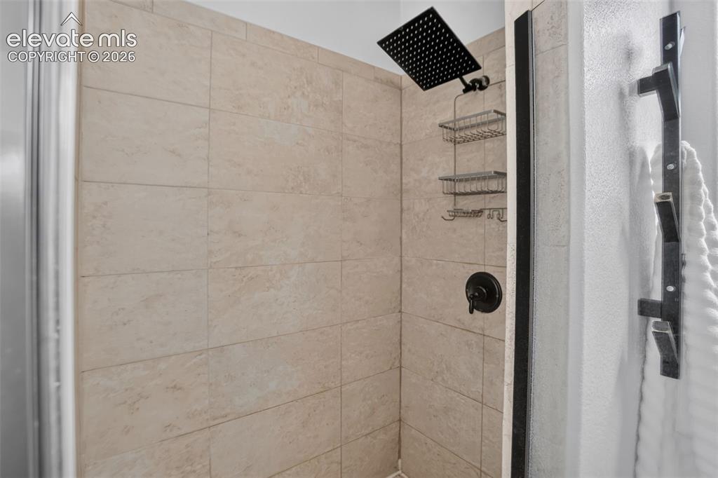 Image 24 of 50: Stand alone shower in primary bathroom.
