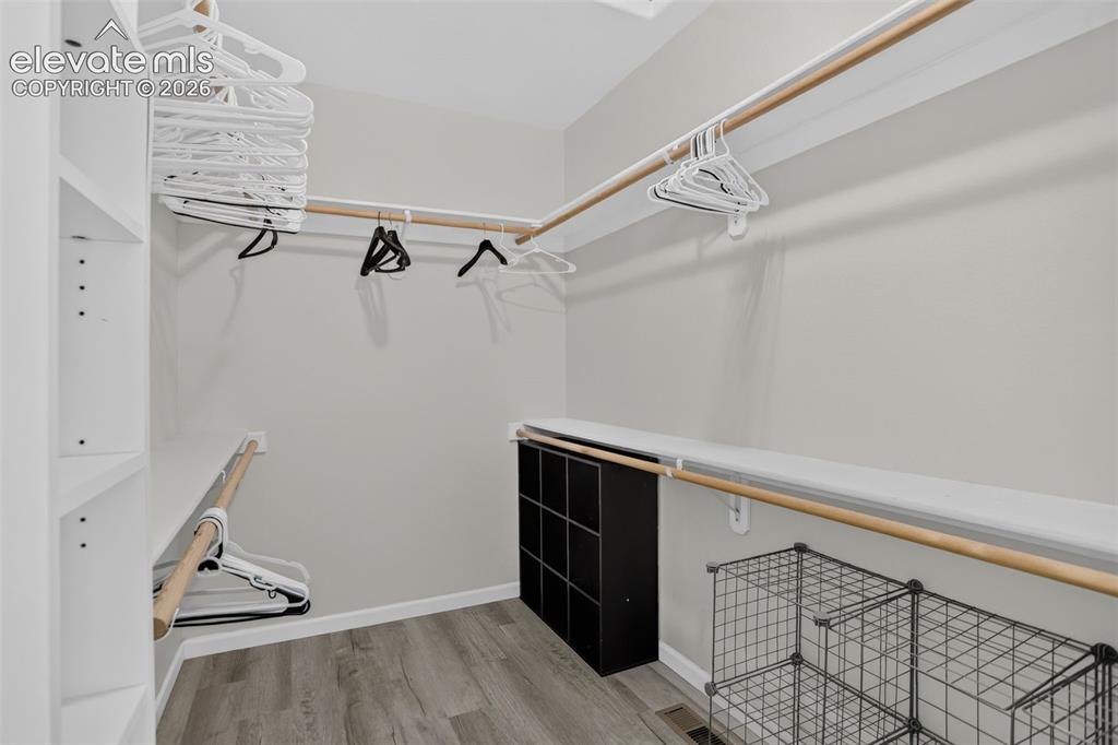 Image 25 of 50: Primary large walk in closet.