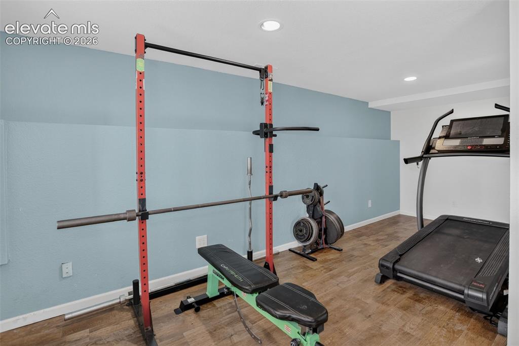 Image 33 of 50: This additional space is ideal for a gym, office or study. Make is what wo