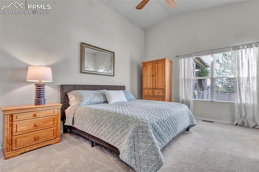 Image 14 of 23: A calming retreat featuring vaulted ceilings and plenty of room to unwind.