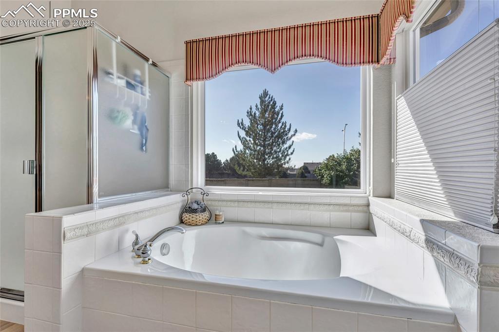 Image 18 of 23: Sunlight and tranquility define this relaxing corner of the home.