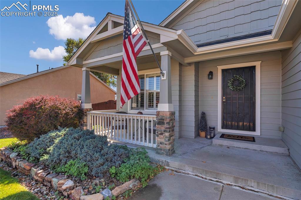 Image 3 of 23: A charming spot to sip your morning coffee or wave hello to neighbors — sma