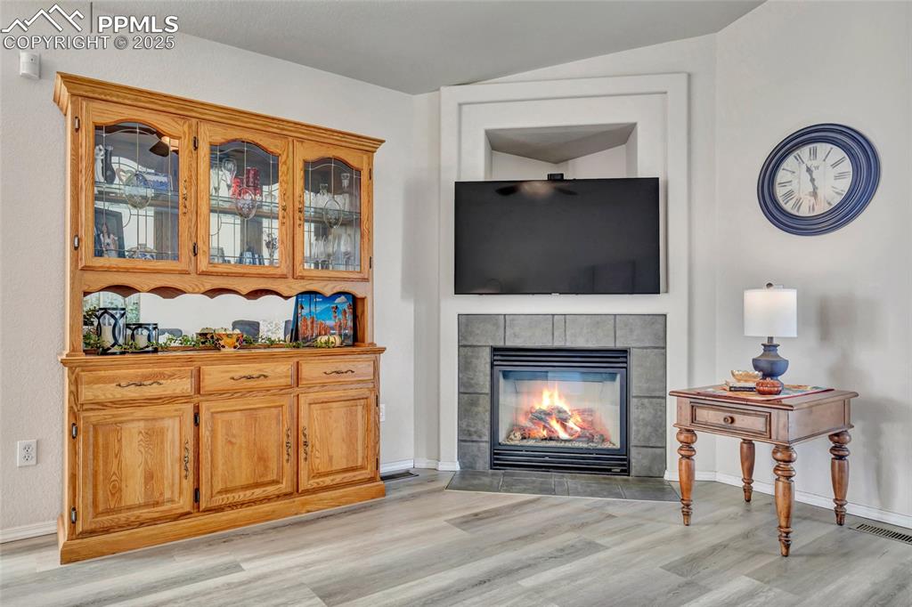 Image 6 of 23: Gather around this warm, modern focal point that adds comfort and style to 