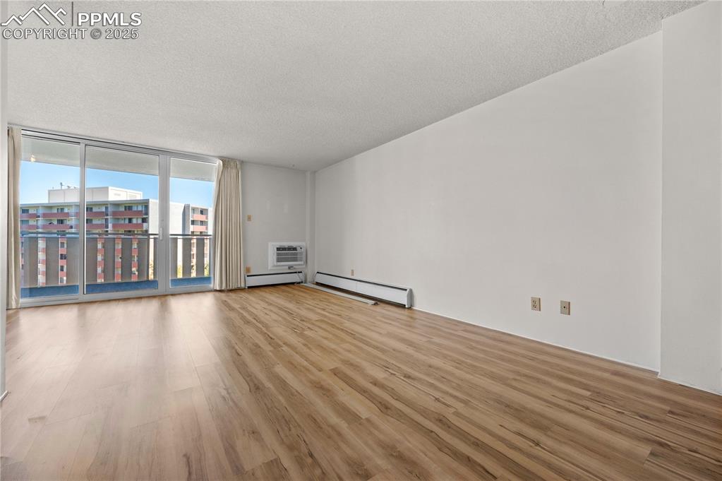 Image 3 of 14: Tons of light, newer wood vinyl floors