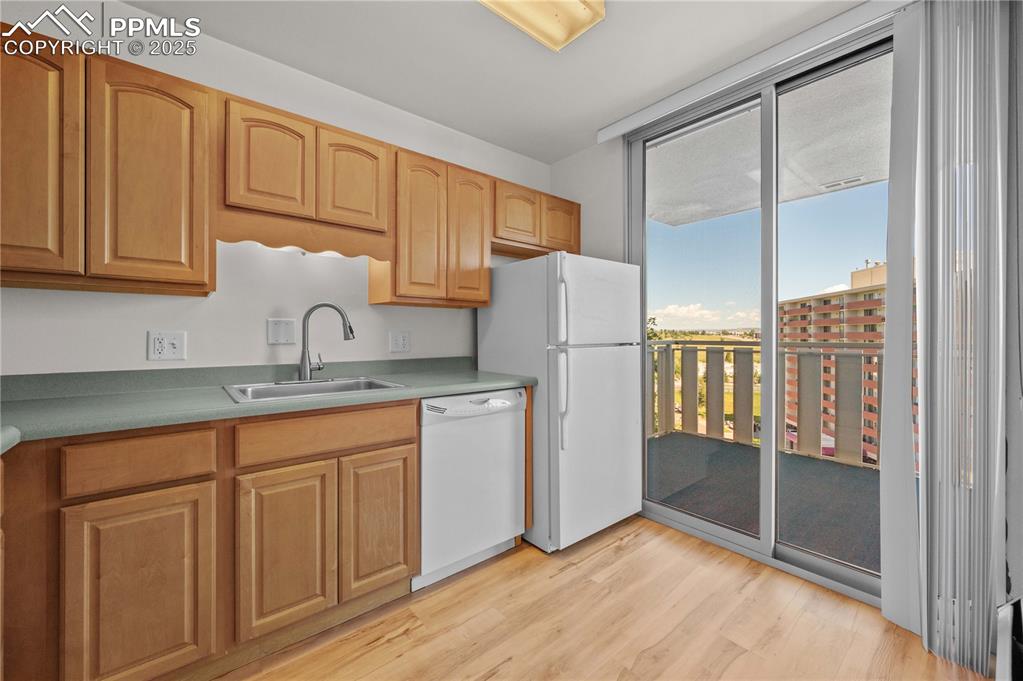 Image 5 of 14: Kitchn has walk out to large patio for those BBQ days.