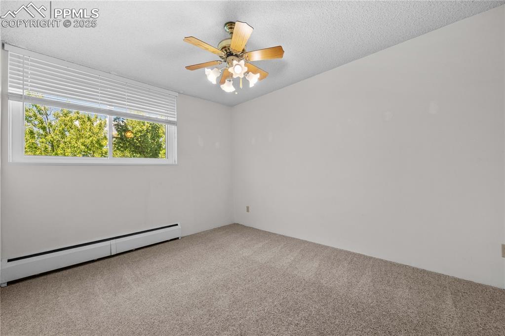 Image 9 of 14: 2nd bedroom and corner unit that allows for a large window.  