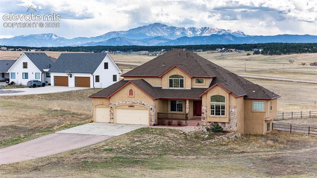 Image 3 of 47: Pikes Peak behind closest neighbor