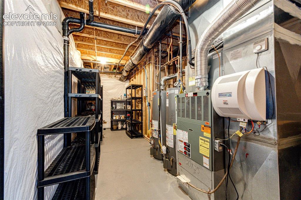 Image 39 of 47: Humidifier, 2 hot water heaters, 1 is new this past year