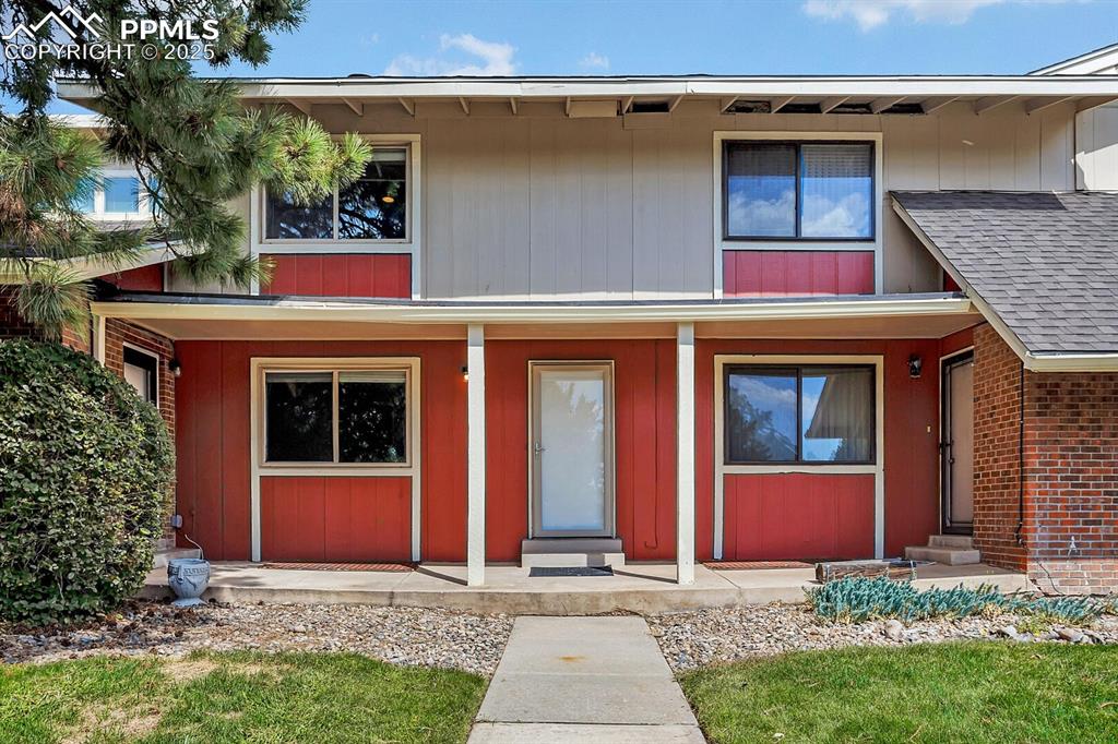 Image 2 of 28: View of property featuring a porch and a shingled roof
