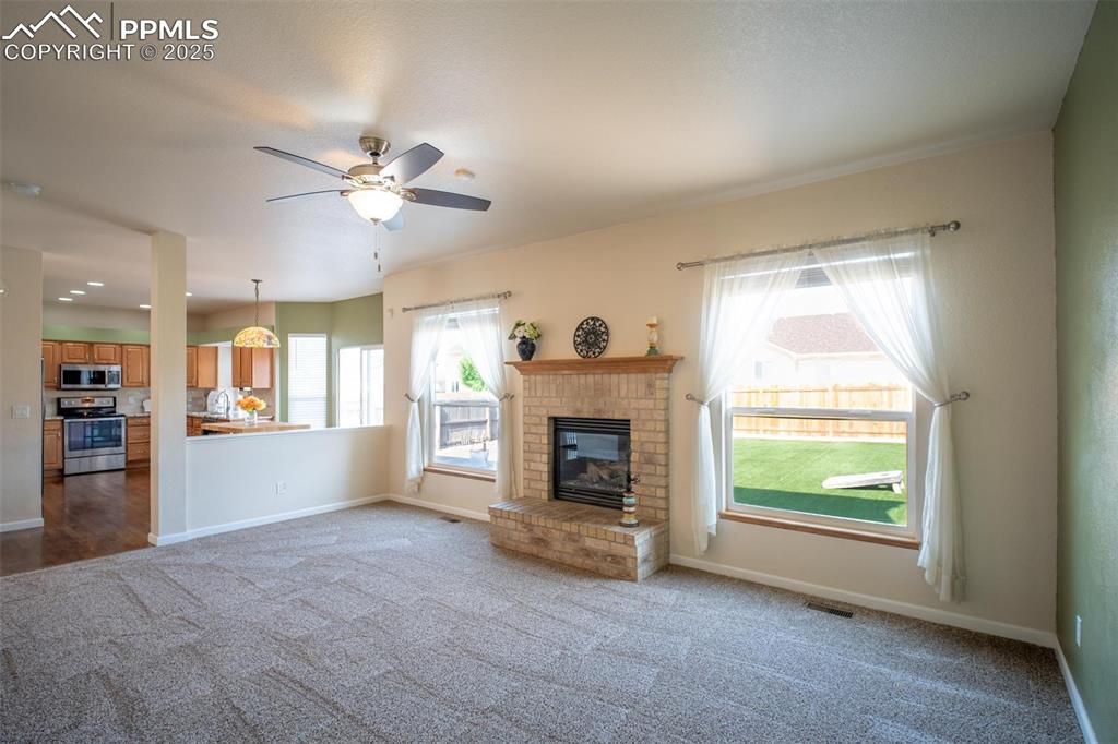 Image 11 of 37: This cozy family room opens to the kitchen 