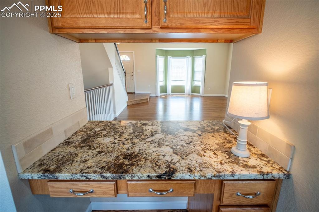 Image 5 of 37: This pass-through offers upper cabinets that open on both sides and a handy