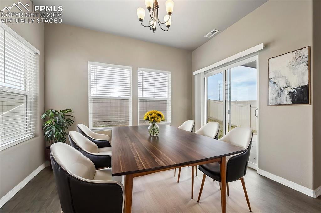 Image 11 of 36: Virtually staged dining room