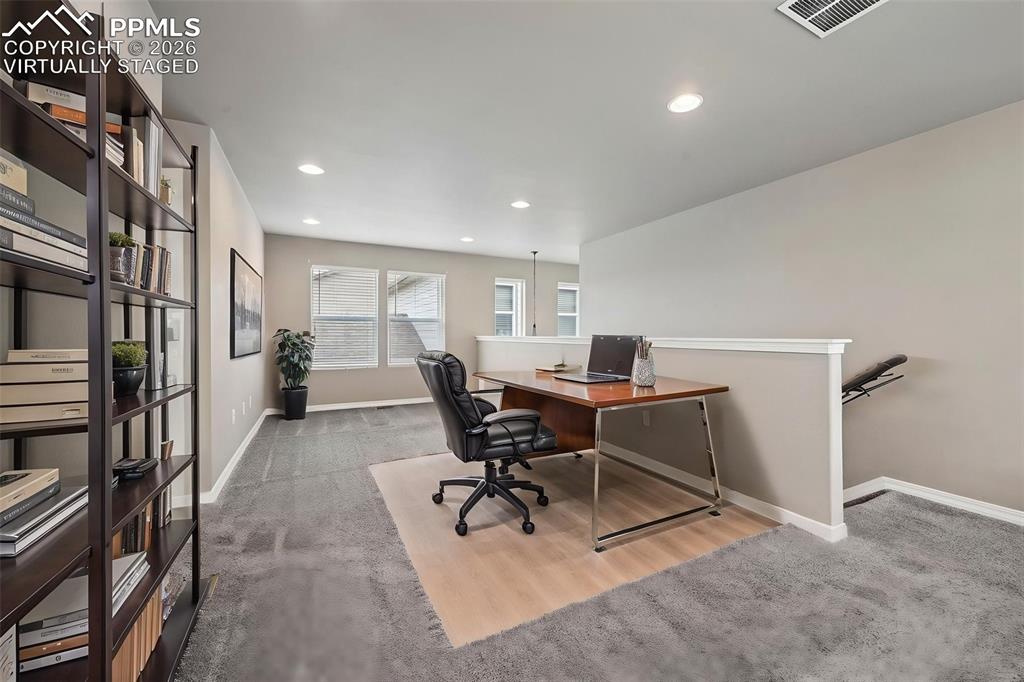 Image 15 of 36: Virtually staged loft, used as office space 