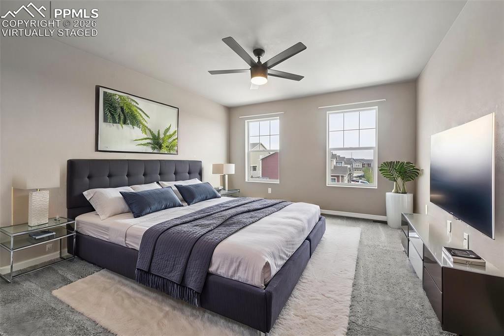 Image 18 of 36: Virtually staged primary bedroom