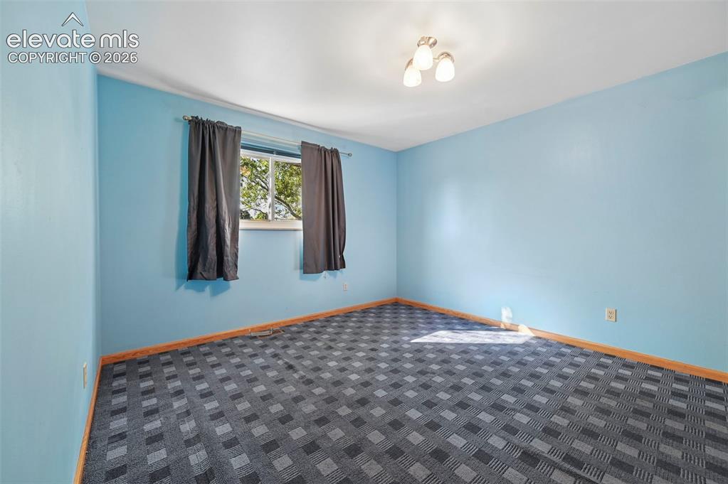 Image 21 of 50: Recessed window with exterior views, flush mount ceiling light, and pattern
