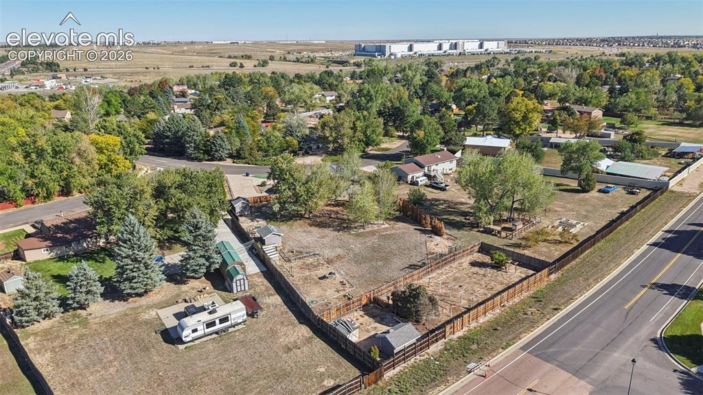 Image 48 of 50: Expansive parcel with perimeter fencing and mature trees